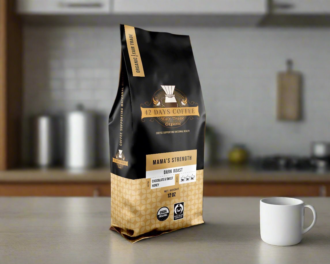Mama's Strength coffee bag sitting on a counter.  Dark roast variety
