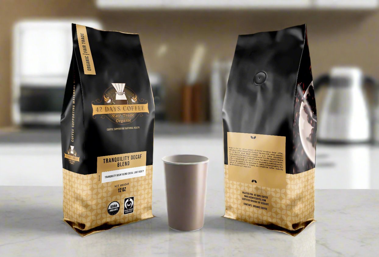 Tranquility Blend Decaf coffee bags.  Front and back view sitting on a counter